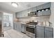 Stylish kitchen featuring modern appliances, ample cabinet space, granite counters, and open concept at 3930 S Hazel Ct, Englewood, CO 80110