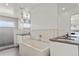 Elegant bathroom featuring a standalone tub, modern fixtures, and a glass-enclosed shower at 3612 Wyandot St, Denver, CO 80211