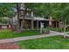 Contemporary home with manicured lawn and 'For Sale' sign, showcasing its curb appeal at 3612 Wyandot St, Denver, CO 80211