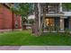 Well-maintained front yard with lush lawn and landscaping, complementing the contemporary home design at 3612 Wyandot St, Denver, CO 80211