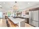 Bright, modern kitchen with stainless steel appliances, large island, and hardwood floors at 3612 Wyandot St, Denver, CO 80211