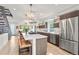 Bright, modern kitchen with stainless steel appliances, large island, and hardwood floors at 3612 Wyandot St, Denver, CO 80211