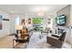 Bright living room with modern fireplace, stylish furniture, and sliding glass doors to the outside at 3612 Wyandot St, Denver, CO 80211