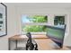 Bright office with a large window providing natural light and a spacious work area at 3612 Wyandot St, Denver, CO 80211