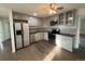 Updated kitchen featuring stainless appliances, gray cabinetry, sleek countertops, and hardwood flooring at 5344 Wheeling St, Denver, CO 80239