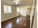 Spacious living room featuring hardwood floors, neutral walls, base molding, and multiple windows at 5344 Wheeling St, Denver, CO 80239