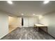 Living room features wood-look floors, recessed lighting, neutral walls, and a wooden table at 5344 Wheeling St, Denver, CO 80239