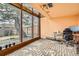 Bright living area with oversized windows and views of the outdoors, with brick floors at 17306 W 17Th Pl, Golden, CO 80401