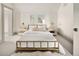 Serene bedroom with white walls, a plush rug, and elegant bedside lamps at 3142 W 26Th Ave, Denver, CO 80211