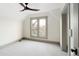 Well-lit bedroom with a ceiling fan, neutral paint, and new carpeting at 3142 W 26Th Ave, Denver, CO 80211