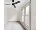 Well-lit bedroom with a ceiling fan, neutral paint, and new carpeting at 3142 W 26Th Ave, Denver, CO 80211