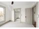 Bright bedroom featuring neutral paint, large windows and a door to a spacious closet space at 3142 W 26Th Ave, Denver, CO 80211