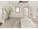 Bright bedroom features plush carpet, stylish decor, and a modern ceiling fan at 3142 W 26Th Ave, Denver, CO 80211
