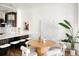Bright dining area with a round table, stylish chairs, and an adjacent modern kitchen at 3142 W 26Th Ave, Denver, CO 80211