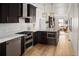Modern kitchen featuring custom cabinets, stainless steel appliances, and a spacious island at 3142 W 26Th Ave, Denver, CO 80211