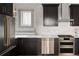 Well-appointed kitchen featuring stainless steel appliances, granite countertops, and modern fixtures at 3142 W 26Th Ave, Denver, CO 80211