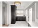 Well-lit laundry room with built-in cabinets, countertops, and a convenient layout at 3142 W 26Th Ave, Denver, CO 80211