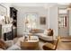 Cozy living room features a fireplace, modern furnishings, and hardwood floors at 3142 W 26Th Ave, Denver, CO 80211