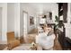 Open-concept living area with stylish furniture, modern decor, and hardwood floors at 3142 W 26Th Ave, Denver, CO 80211