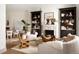 Inviting living room with a fireplace, stylish built-ins, and comfortable modern furniture at 3142 W 26Th Ave, Denver, CO 80211