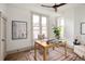 Bright home office featuring natural light, hardwood floors, and a modern ceiling fan at 3142 W 26Th Ave, Denver, CO 80211