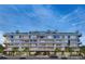 Contemporary multi-story condo building featuring expansive windows and rooftop terrace landscaping at 185 N Steele St # 204, Denver, CO 80206