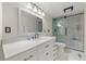 Clean bathroom with quartz countertop and walk-in shower at 24149 Shooting Star Dr, Golden, CO 80401