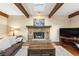 Stone fireplace in living room with hardwood floors at 24149 Shooting Star Dr, Golden, CO 80401