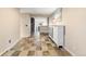 Long hallway with tile floors and a built-in cabinet at 24149 Shooting Star Dr, Golden, CO 80401