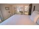 Bright bedroom showcasing a comfortable bed and mirrored closet doors with views into other rooms at 5845 W Mansfield Ave # 259, Denver, CO 80235