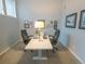 Spacious home office designed for collaboration, featuring two desks, comfortable chairs and a gallery wall at 5845 W Mansfield Ave # 259, Denver, CO 80235