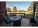 Enjoy relaxing views of the green golf course from this patio with outdoor seating at 5845 W Mansfield Ave # 259, Denver, CO 80235