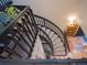 Unique staircase showcasing access to multiple levels of the home including hardwood and carpeted floors at 5845 W Mansfield Ave # 259, Denver, CO 80235