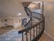 A winding staircase leads up to a second story and down to a large lower level at 5845 W Mansfield Ave # 259, Denver, CO 80235