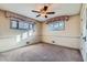 Spacious bedroom with neutral carpeting and large windows at 942 Leroy Dr, Northglenn, CO 80233