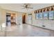 Sunlit Gathering room with tiled floors and access to the kitchen at 942 Leroy Dr, Northglenn, CO 80233