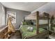 Comfortable bedroom with a bunk bed, playful decor, and window view at 32094 Christopher Ln, Conifer, CO 80433