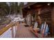 Exterior features a wooden deck with unique ski-themed chairs and mountain views at 32094 Christopher Ln, Conifer, CO 80433