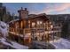 Charming wooden cabin with a spacious deck and stunning mountain views, perfect for enjoying the outdoors at 32094 Christopher Ln, Conifer, CO 80433