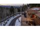 Aerial view features a hot tub on a beautiful deck with scenic mountain views at 32094 Christopher Ln, Conifer, CO 80433