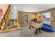 Game room with rustic accents, sink, and Foosball table with views of the snowy outdoors at 32094 Christopher Ln, Conifer, CO 80433