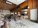 Wide view of garage interior showing exposed beams, work area, and additional space at 32094 Christopher Ln, Conifer, CO 80433