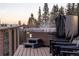 Deck features a private hot tub with scenic views of surrounding mountains and forest at 32094 Christopher Ln, Conifer, CO 80433