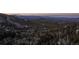 A view of the surrounding tree-covered mountains in the area at 32094 Christopher Ln, Conifer, CO 80433