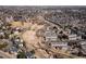 Expansive aerial view of a townhouse community with tree-lined streets and neighborhood amenities at 3971 S Quintero Way, Aurora, CO 80013