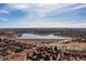 Beautiful aerial view of community and lake with blue sky at 3971 S Quintero Way, Aurora, CO 80013