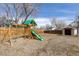 Spacious backyard with a play structure and shed, perfect for Gathering fun at 3971 S Quintero Way, Aurora, CO 80013