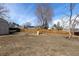 Large backyard with play structure and shed, offering plenty of space at 3971 S Quintero Way, Aurora, CO 80013