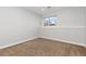 Simple bedroom with neutral walls and carpet, offering a blank canvas for personalization at 3971 S Quintero Way, Aurora, CO 80013