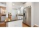 Bright kitchen with granite counters, stainless steel appliances, and white cabinets for a modern touch at 3971 S Quintero Way, Aurora, CO 80013